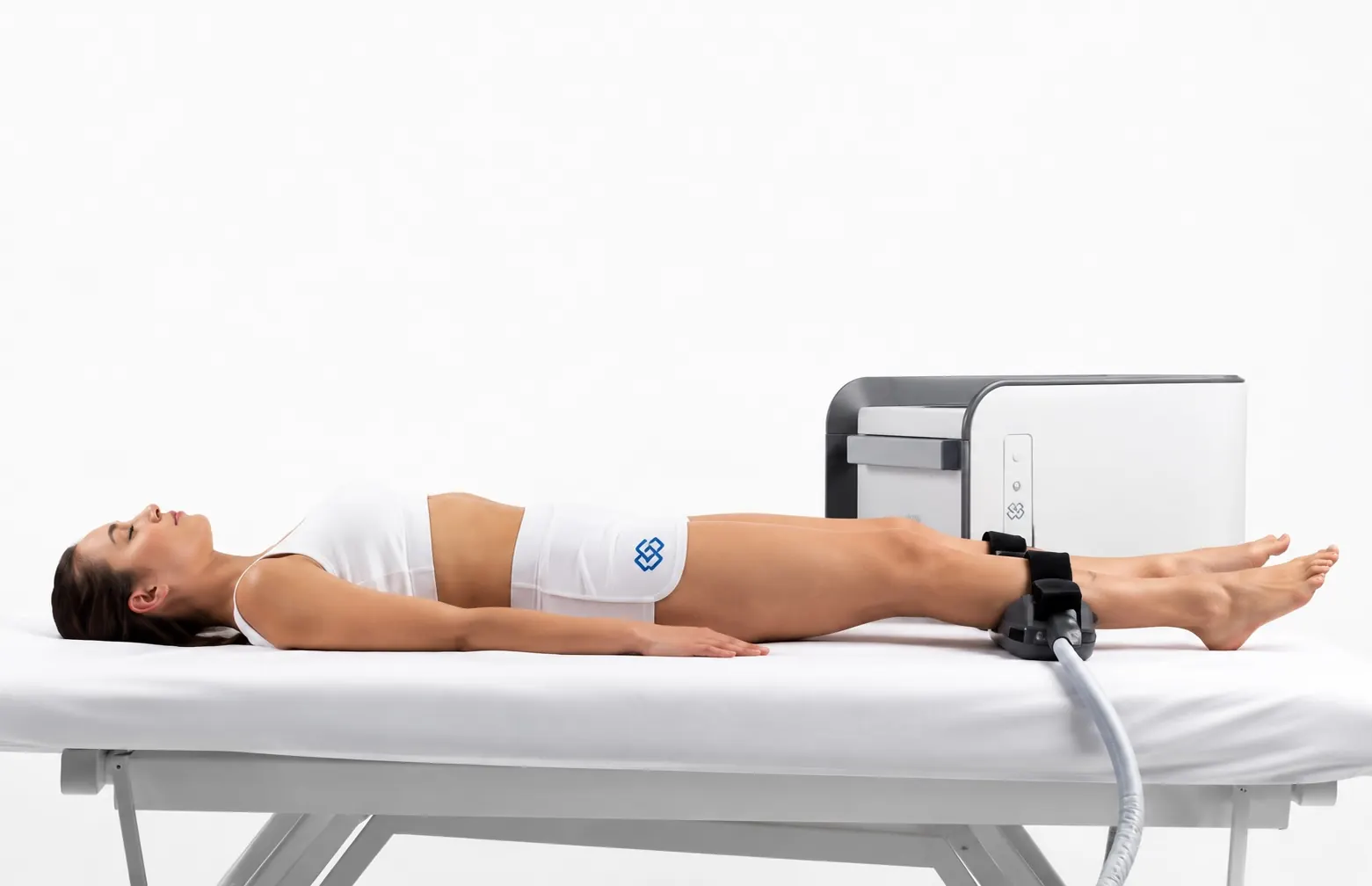 Body muscle-stimulation applicators positioned on a patient's abdomen at 23MD