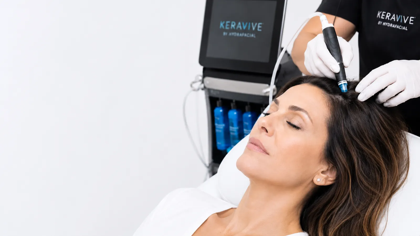 A scalp cleansing applicator being used during a hair and scalp treatment at 23MD