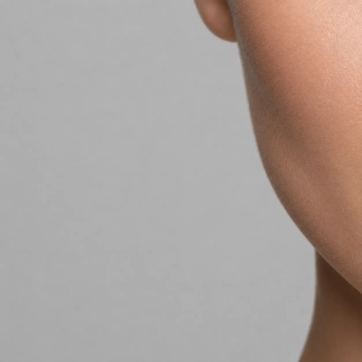 A patient in a clinic robe receiving a skin booster injection at 23MD